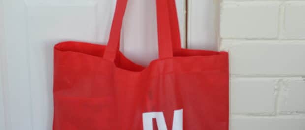 WT17 - Red Tote on White Brick Vertical